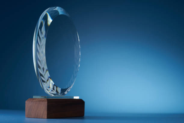 istock crystal trophy against blue background 1399326884