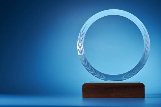istock crystal trophy against blue background 1399326897