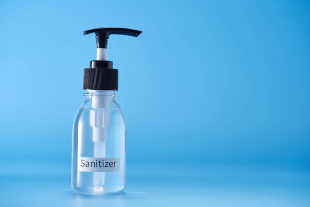 istock hand sanitizer against blue background 1399327739