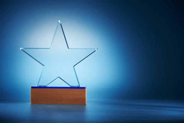 istock crystal star shape trophy against blue background 1399328036