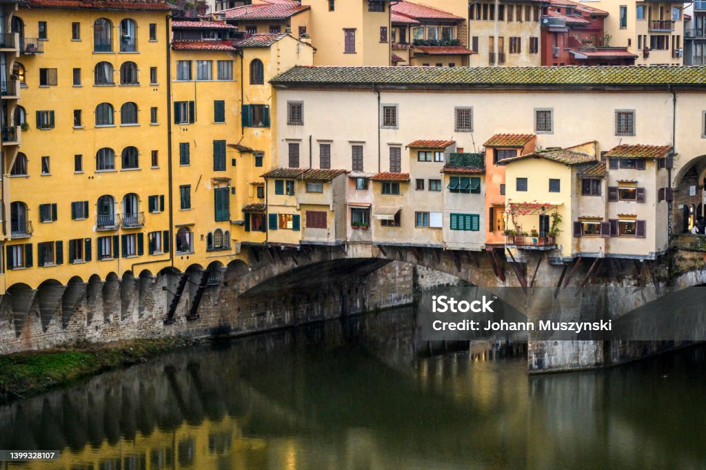 The Ponte Vecchio of Florence The Ponte Vecchio of Florence is a closed-spandrel segmental stone arch bridge, built in 1345. "nToday, there are jewelry stores there. Florence, Italy, 14 november 2021. Color Image Stock Photo