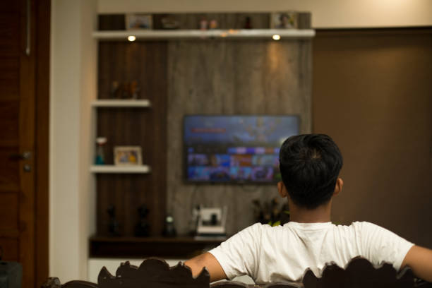 istock Young boy watching smart TV at home 1399328745