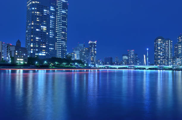 istock Illuminated Tsukuda Bridge, Chuo Bridge, Sky Tree, and light trails of the ship seen from the Sumida River 1399328870