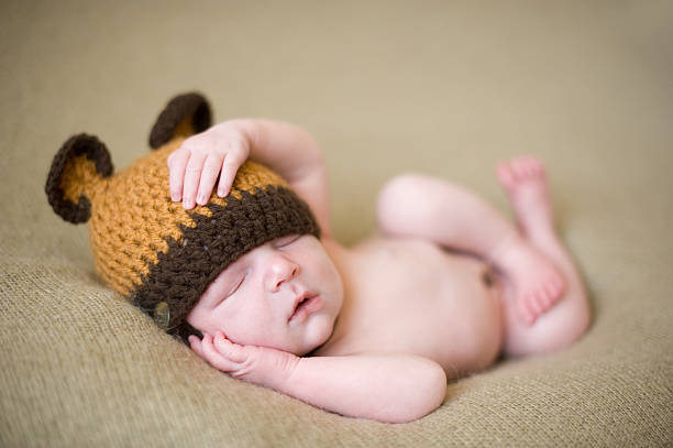 istock Sleeping Newborn in Bear Knit Hat 139933240