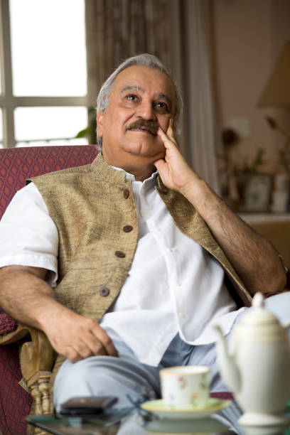 istock Thoughtful old man sitting on chair 1399333285