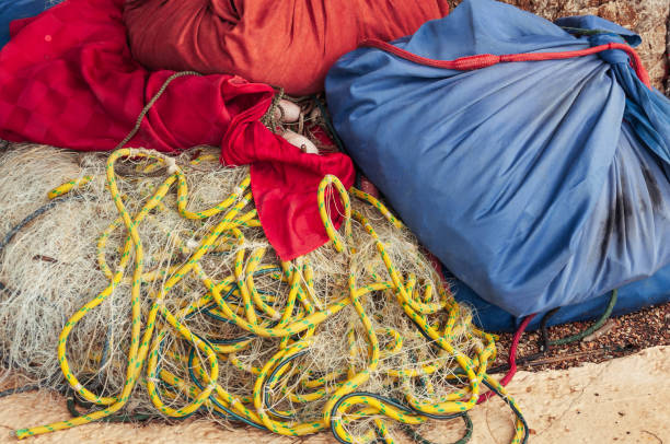 istock fishing accessories, fish nets and backpacks with accessories close-up 1399333323
