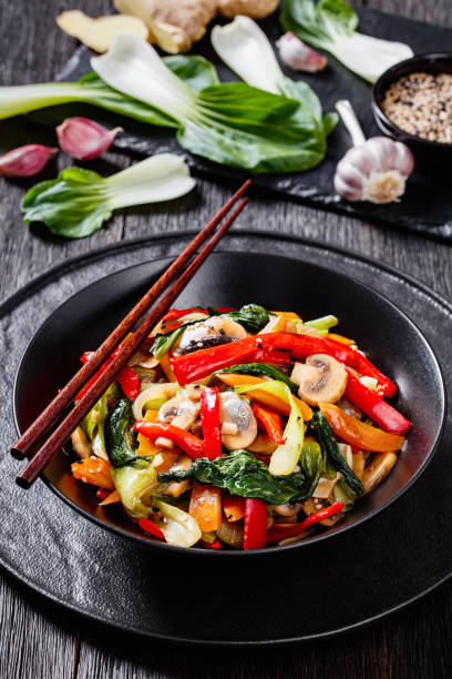 istock Stir Fry Vegetables in black bowl, top view 1399333452