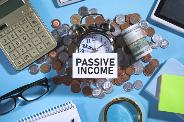 istock Passive Income on credit card with a coins and other objects. 1399334799