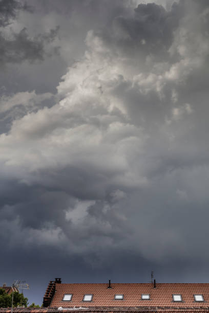 istock Stormy clouds above the city rooftops 1399335802