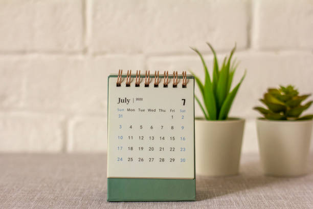 istock Desktop calendar for July 2022 on the table. 1399336698