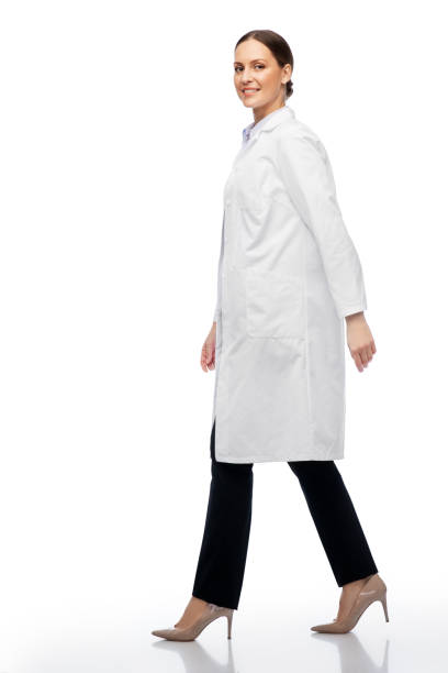 istock smiling female doctor or scientist walking 1399340177