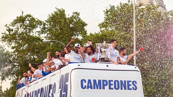 Madrid, Spain; 04-30-2022: Team bus arriving at Plaza de Cibeles with the players celebrating and waving to celebrate the thirty-fifth League title conquered by Real Madrid