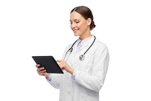 medicine, profession and healthcare concept - happy smiling female doctor in white coat with tablet pc computer and stethoscope