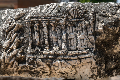 Carving of the Ark of the Covenant on a lintel at the ruins of Capernaum on the Sea of Galilee in Israel