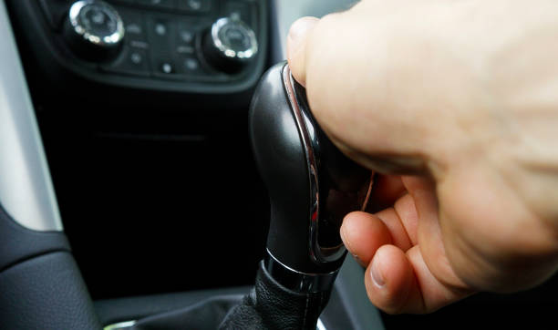istock As The Car Moves, a Man's Hand changes the Speed on the Gearbox. 1399341290
