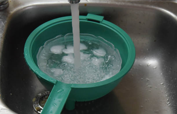 istock iced water, cold water with ice cubes 1399346470