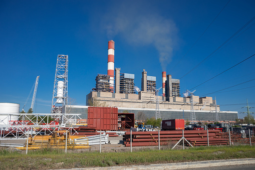 Obrenovac, Serbia - April 12, 2022: A thermoelectric plant 'Nikola Tesla' aka TENT near Obrenovac and Belgrade on river Sava in Serbia, with big chimneys in a rural landscape