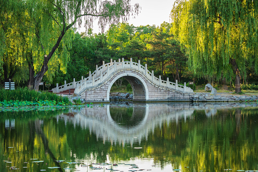 Stone arch bridge in the Old Summer Palace in Beijing, China