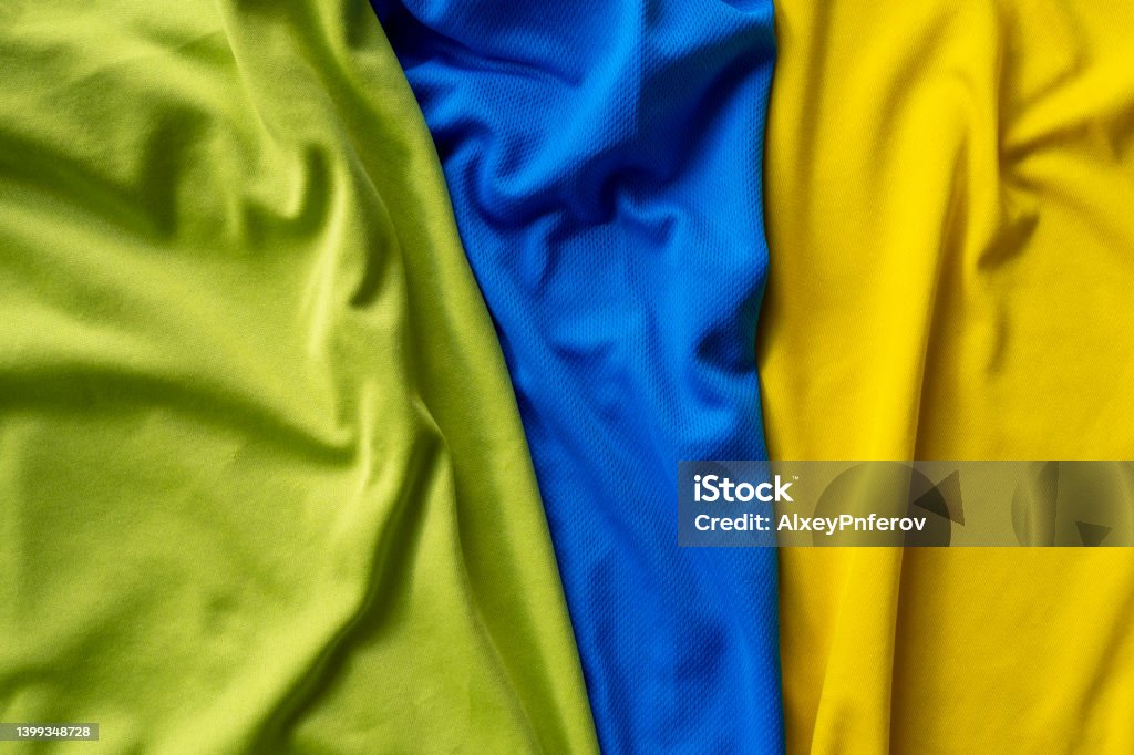 Three polyester, nylon folded sport shirts, top view Polyester Stock Photo