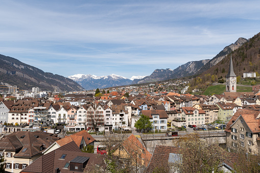 Chur, Switzerland, April 11, 2022 Fascinating view over the downtown area with the wonderful alps in the background in spring time