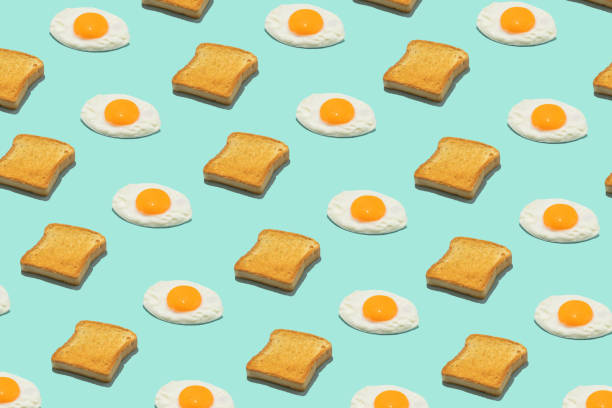 istock Seamless creative food pattern. Fried eggs and toasts on a blue background. Funny colorful breakfast concept. 1399354020