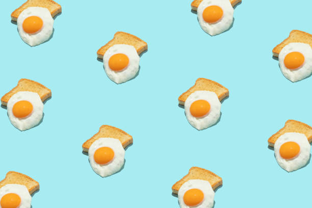istock Seamless creative food pattern. Fried eggs on blue background. Colorful food concept. 1399354022