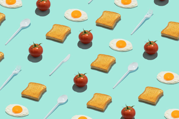 istock Seamless creative food pattern. Toasts, eggs, tomatoes and plastic food utensils on a blue background. Funny colorful breakfast concept. 1399354074