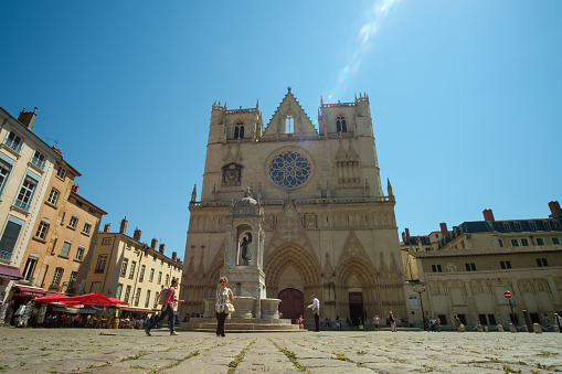 Lyon, France - May 11, 2022 : Panoramic view of the Cathedral Saint-Jean Baptist and the square in front full of tourists