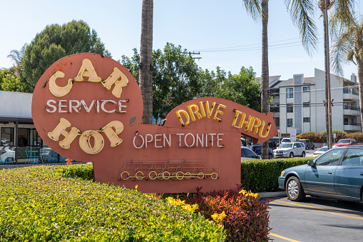 Burbank, California, USA - May 05 2022: A retro style sign at Bob's Big Boy in Burbank for the car hop drive through service.