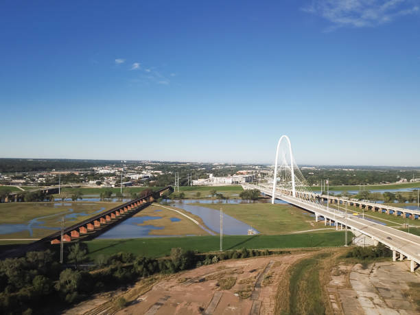 istock Aerial view Margaret Hunt Hill Bridge and Texas & Pacific Railroad Trinity River Bridge looking South from Dallas, Texas, America 1399356907