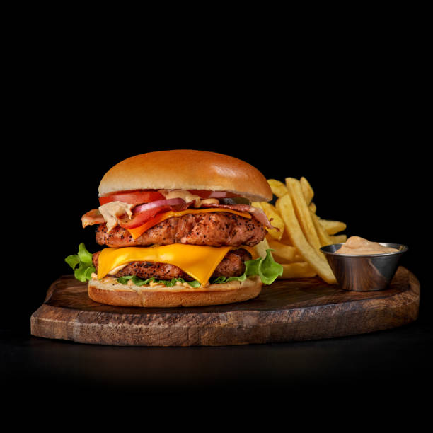 istock Big sandwich - hamburger burger with beef, tomato, pickled cucumber and fried bacon. 1399360603