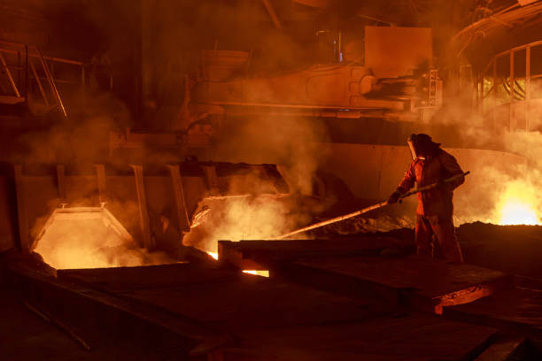 istock Man works in blast furnace workshop. 1399361023