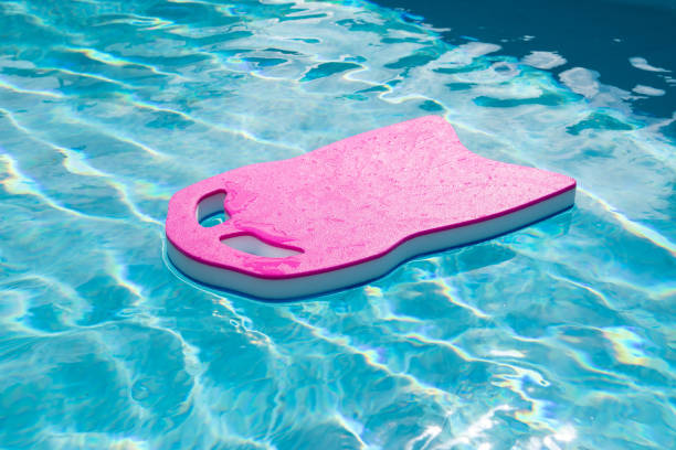 istock Pink floating board in outdoor swimming pool. 1399362408