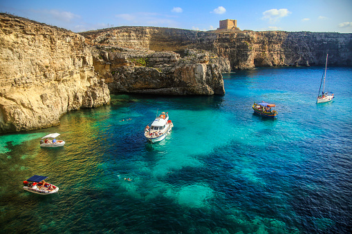 Crystal Lagoon and Saint Mary's Tower on Comino island on Malta.