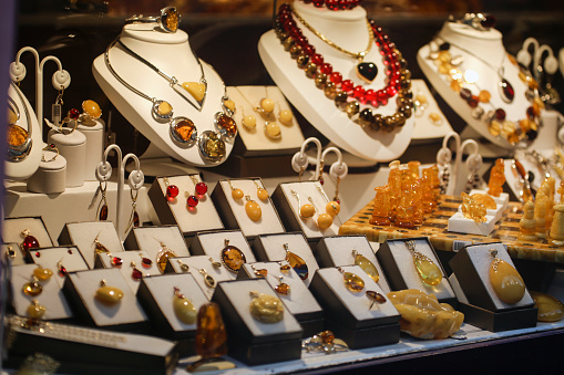 Window display of a jewelry store selling amber jewelry.