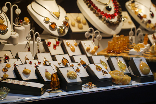 Window display of a jewelry store selling amber jewelry.