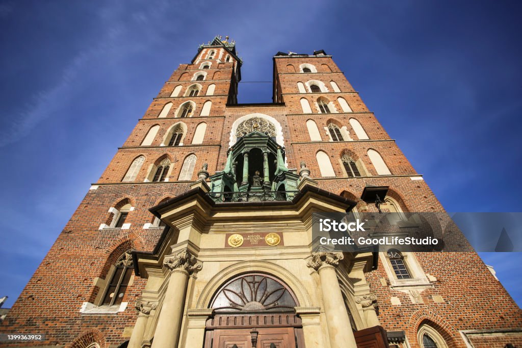 St. Mary's Basilica in Krakow St. Mary's Basilica on Main Market Square in Krakow, Poland. Architecture Stock Photo