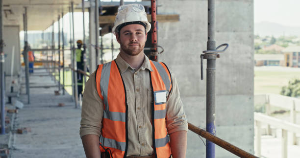 istock Portrait of a building contractor working on a construction site. A confident young man working on an architecture project, looking at the camera 1399364898