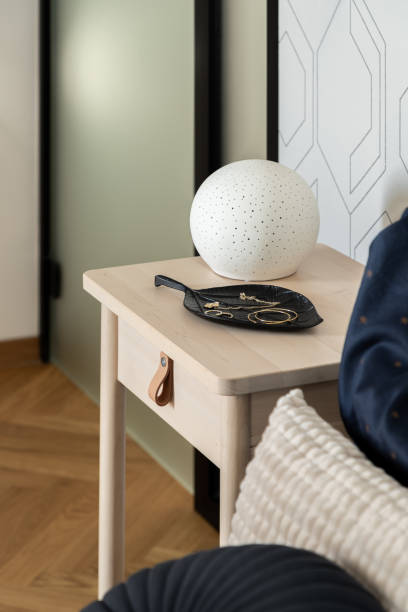 istock Stylish decoration on wooden bedside table 1399364931