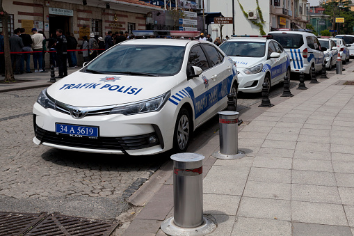 Istanbul, Turkey - May 09 2019: Row of cars from the Trafik polisi (Traffic Police) parked in a street.