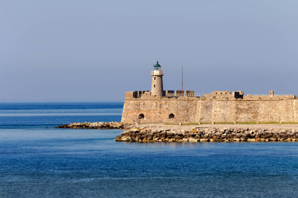 istock Ancient lighthouse and the sea on a sunny day 1399369433