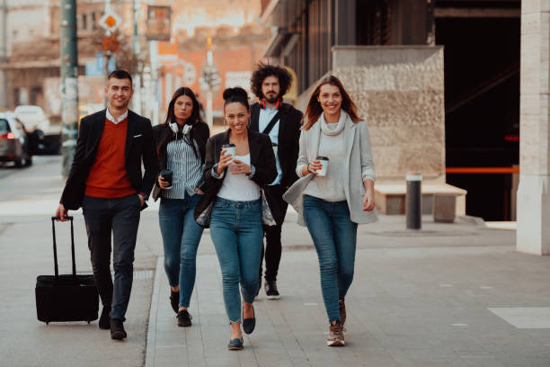 istock businesspeople group walking in a modern city.. 1399370405