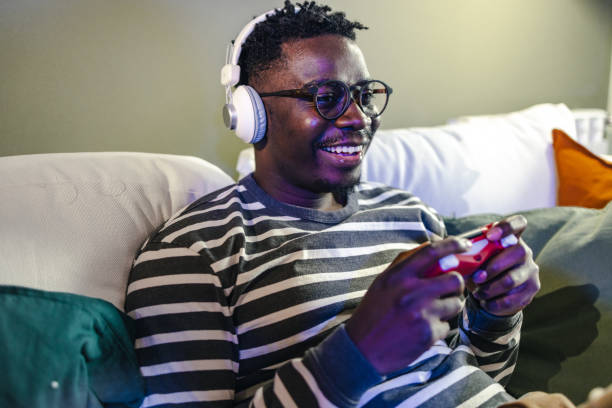 istock Happy African-American man play video game 1399370427
