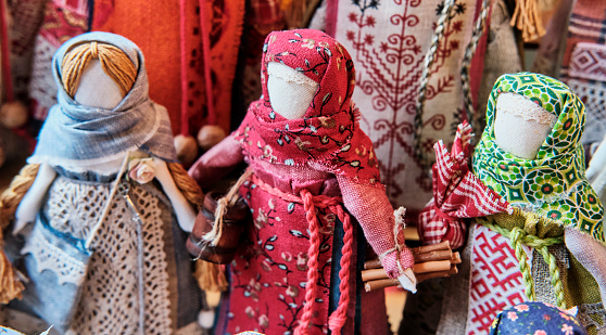 Russian traditional faceless rag dolls - amulets associated with slavic pagan traditions, as handmade souvenirs or gifts.Close-up