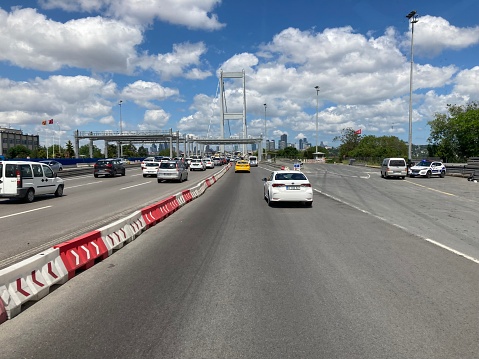 Boğaziçi Köprüsü, İstanbul, Turkey - 05 25 2022: While crossing the Istanbul Bosphorus Bridge with a car, accompanied by a deep blue sky.