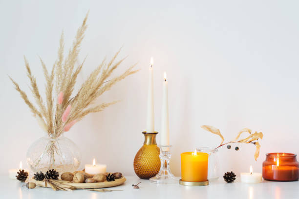 istock autumn home decorations with burning candles 1399380144
