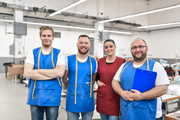 istock Portrait Of Smiling Textile Workers At Their Workplace 1399380173