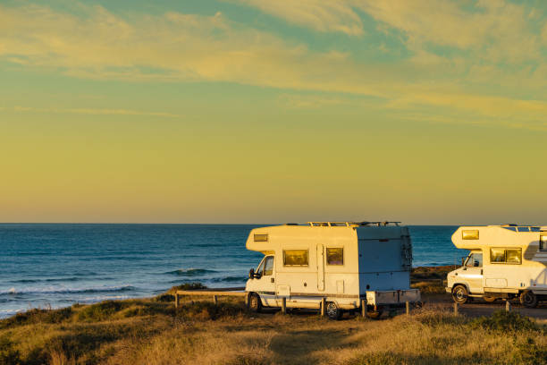 istock Camper rv camping on sea shore, Spain 1399380245