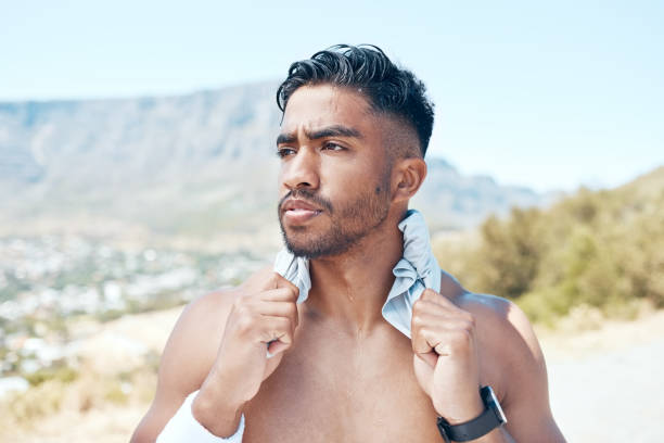 istock A young mixed race man looking serious standing topless in the road after exercising outside. Indian male focused and feeling satisfied with his daily workout 1399381521