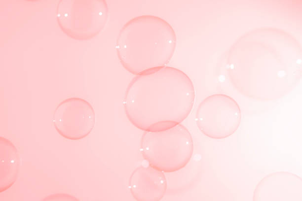 istock Abstract Beautiful Transparent Pink Soap Bubbles Background. Soap Sud Bubbles Water. 1399383572